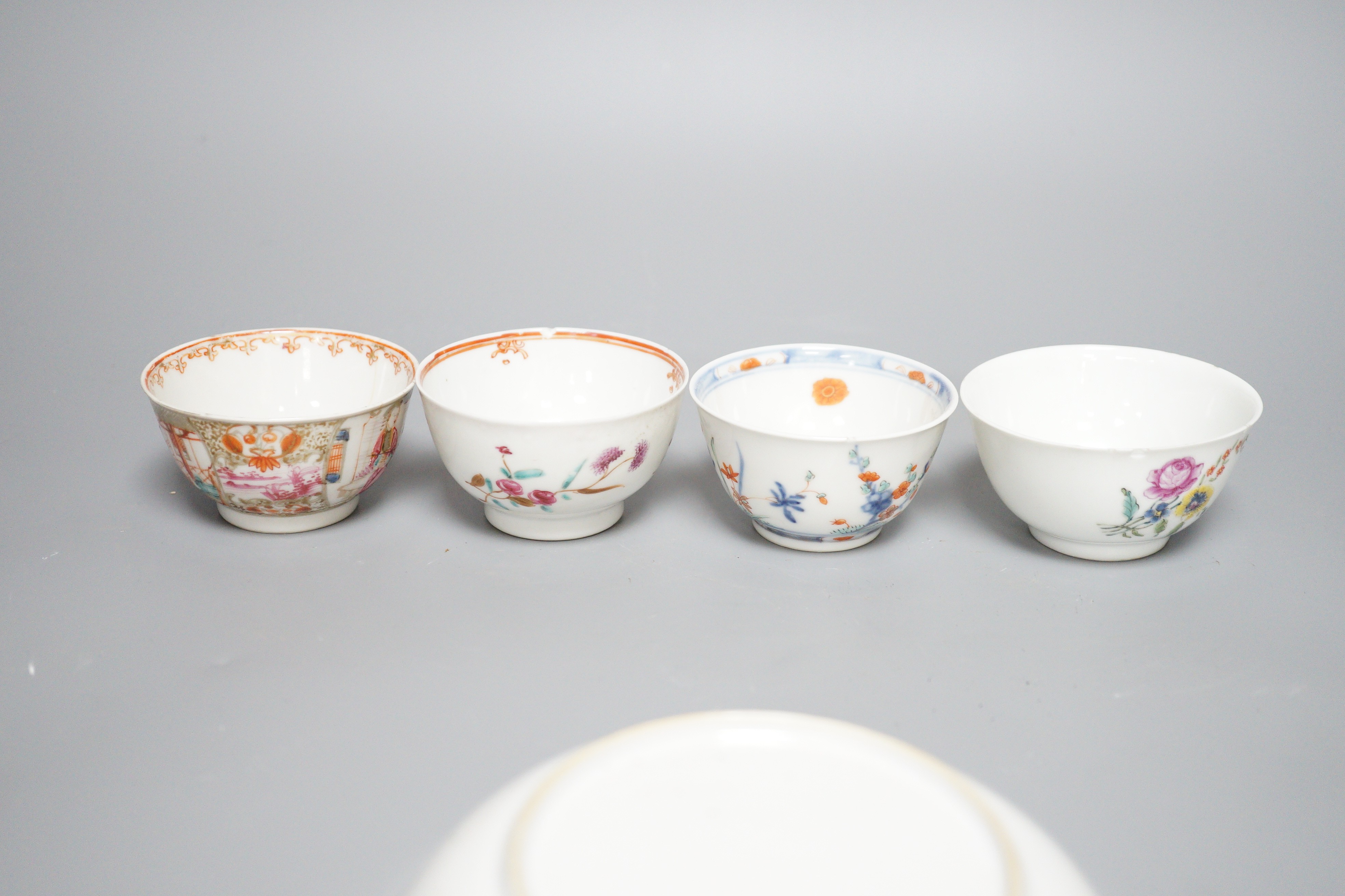 A 19th century Chinese Tobacco Leaf pattern saucer and four various teabowls